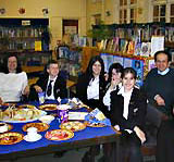 Latin pupils with a Roman meal.